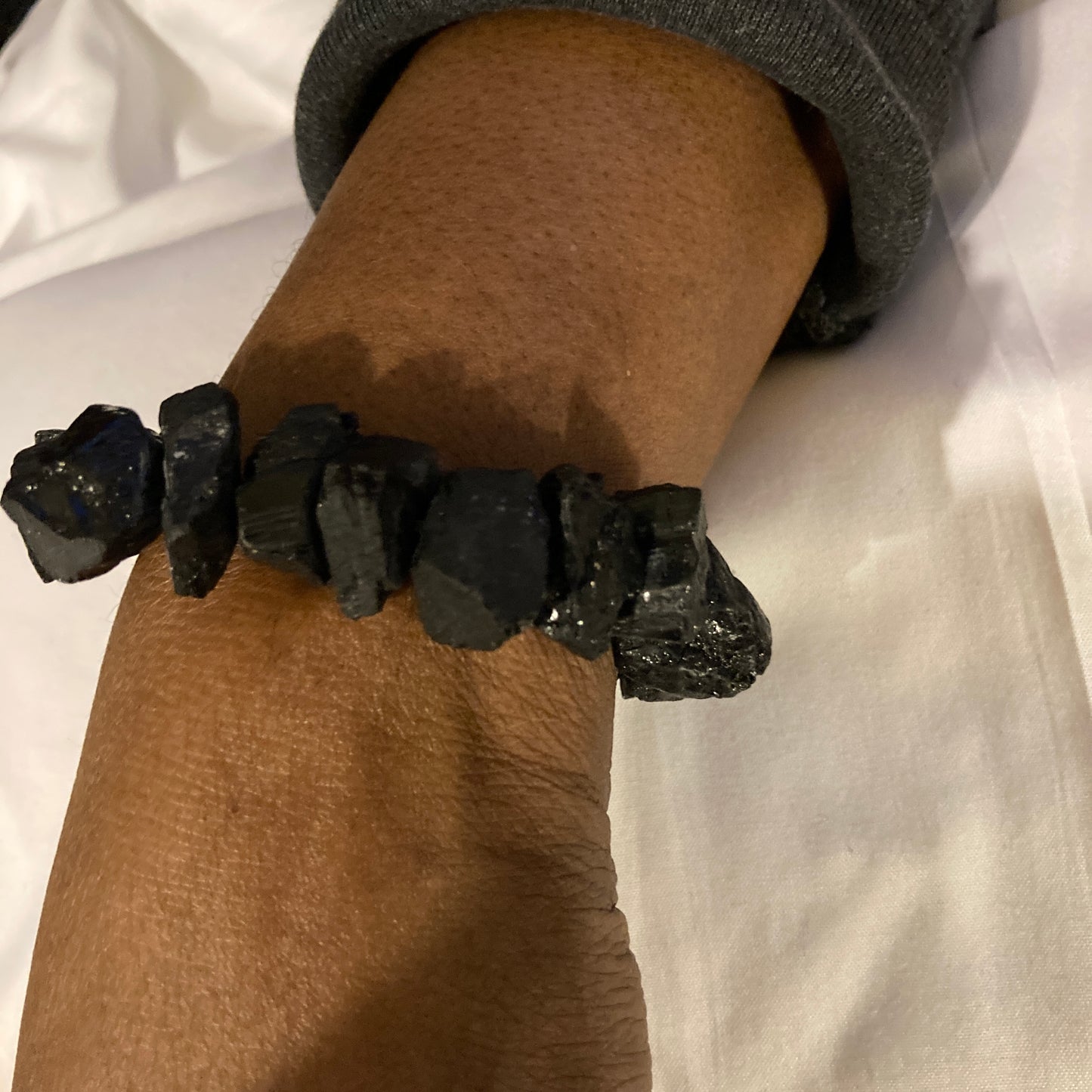 A handmade crystal bracelet of raw, natural,  black tourmaline chunks. This wristpeacemaker is a show stopper. 